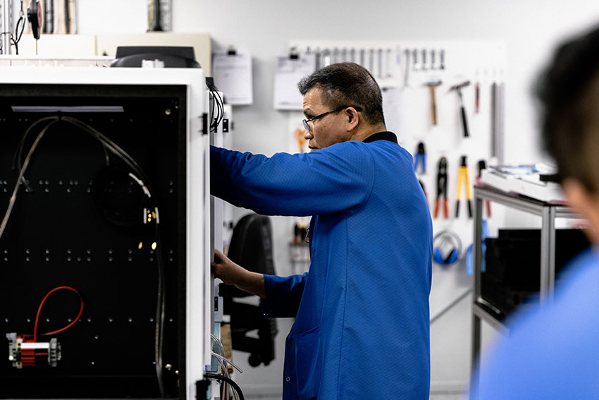 man assembling electrical products