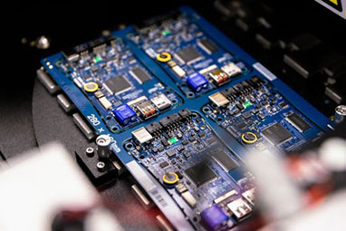 electrical comonents on a blue pcb